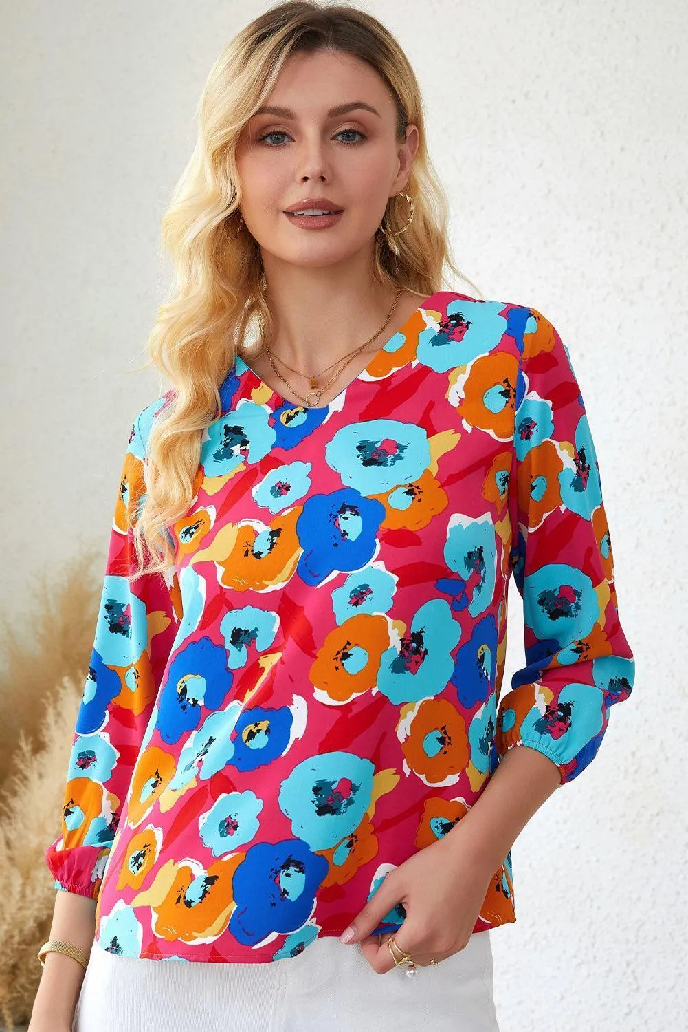 Vibrant Three-Quarter Sleeve Floral V Neck Top